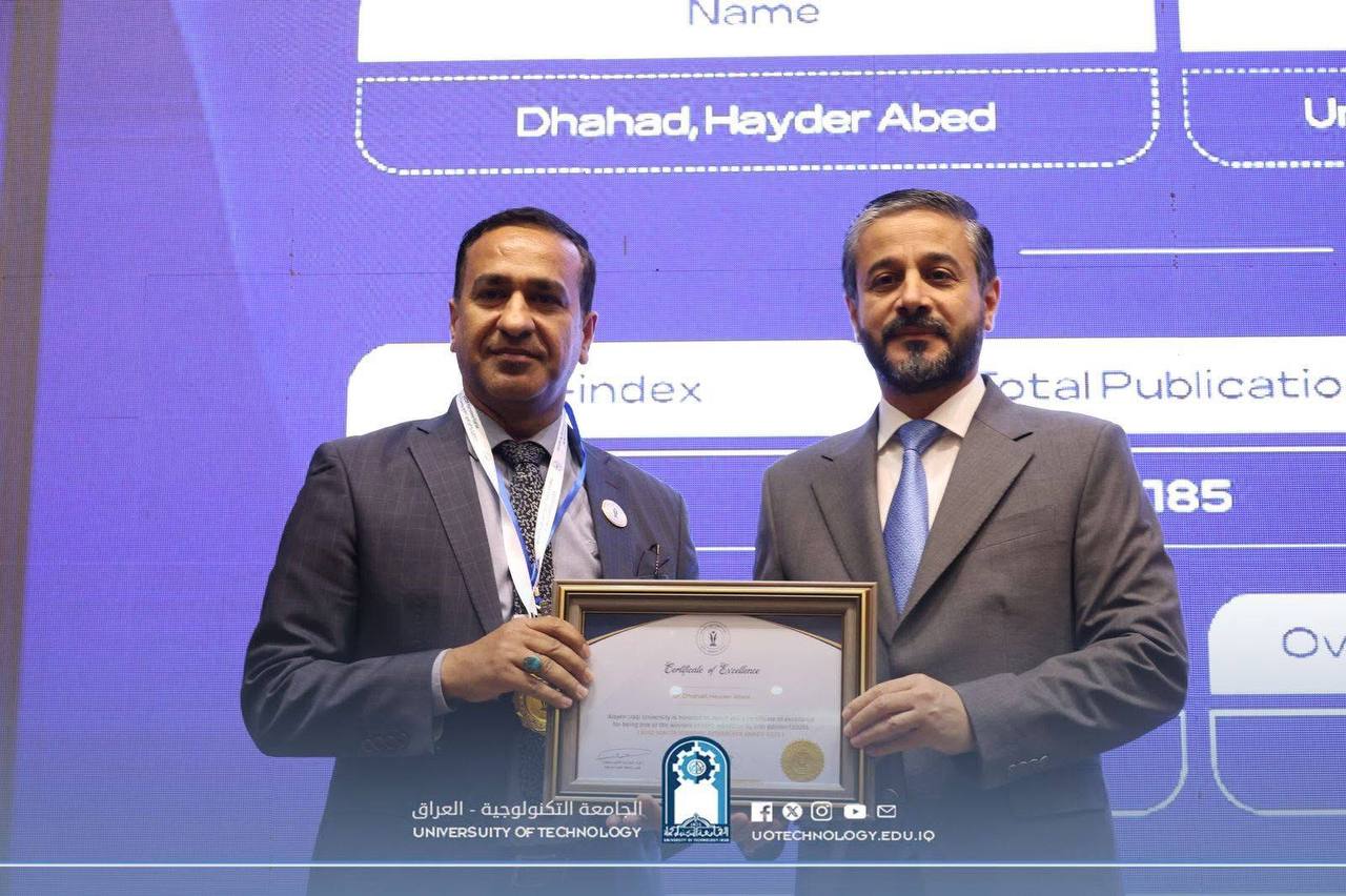 The Minister of Higher Education and Scientific Research honors the Director of the Training and Workshops Center at the Academic Researcher Awards ceremony at Al-Ain University in Iraq.